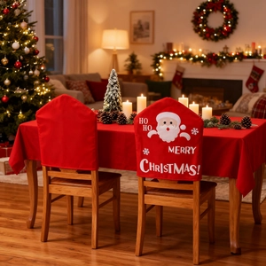 Classic red Christmas chair covers and tablecloth set with festive Santa Claus graphics