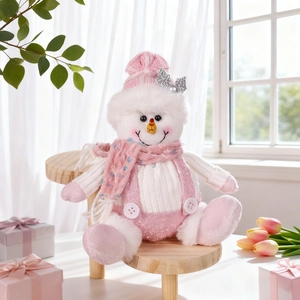 Detailed view of pink sequin snowman plush with knit hat and scarf for Christmas decor