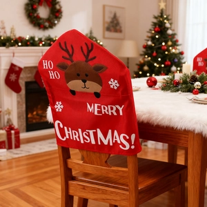 Close-up of red Christmas chair cover featuring reindeer applique and festive Merry Christmas text
