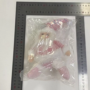 Detailed view of pink sequined Santa plush with ruler measuring 20cm height and width