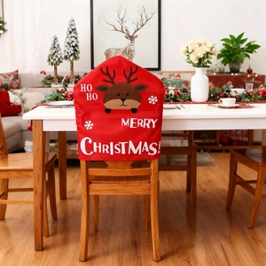 Close-up of red Christmas chair cover with 3D reindeer and Merry Christmas text