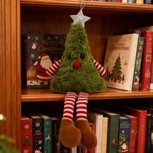 Plush Christmas tree ornament with long striped legs on a festive wooden bookshelf