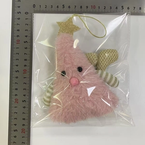 Detail of pink plush Christmas tree doll with measurement scale and festive star