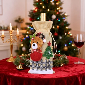 Christmas burlap wine bottle bag featuring a plush bear and sequined tree on red velvet