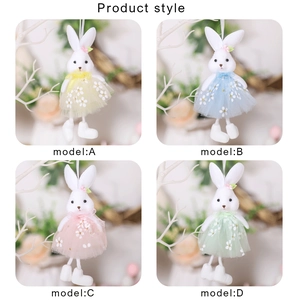 Detailed grid view showing four styles of Easter bunny plush dolls in mesh skirts