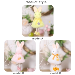 Three plush Easter bunny hanging decorations in pink, yellow and white with cute outfits