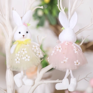 Easter plush bunny pair in yellow and pink floral tulle skirts on decorative branches