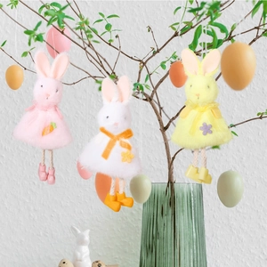 Hanging plush Easter bunny dolls with mesh skirts on decorative branches with colorful eggs