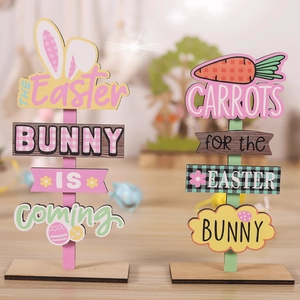 Detail of Easter wooden bunny signs with The Easter Bunny Is Coming and Carrots text