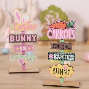 Detail view of two Easter wooden table signs with bunny ears and carrot patterns