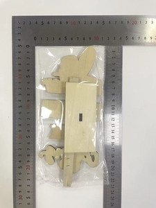 Detailed view of laser-cut wooden Easter bunny sign with dimensions and natural texture