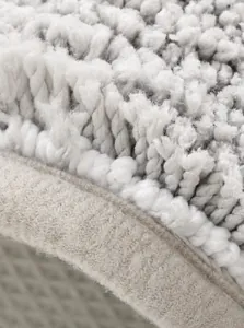 Detailed macro view of the soft grey microfiber bath mat with premium reinforced stitching