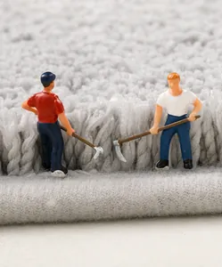 Macro detail of high-density plush fibers on a thick grey absorbent bathroom mat