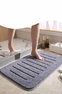Macro detail of plush grey bath mat with absorbent ribbed texture for bathroom comfort