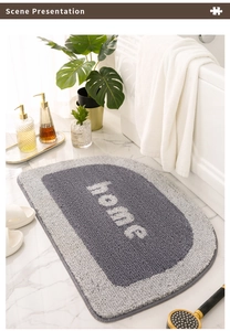 Detailed view of a semi-circle absorbent bathroom mat with home text in a modern bath setting