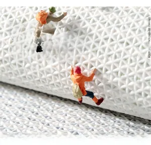Detailed view of white TPR non-slip bath mat featuring diamond texture and waterproof base