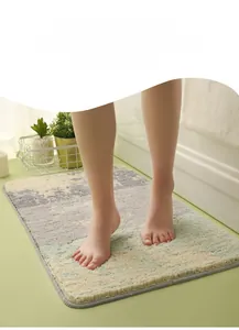Close-up of plush shaggy bathroom mat featuring a modern geometric color block design