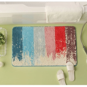 Macro view of colorful striped plush bath mat on bathroom floor with soft texture
