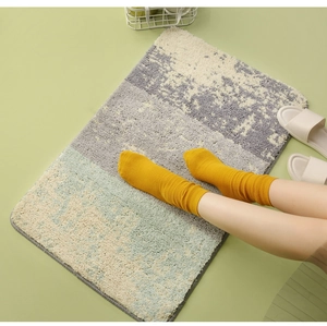 Detailed view of thick plush absorbent bathroom mat with abstract tufted pattern