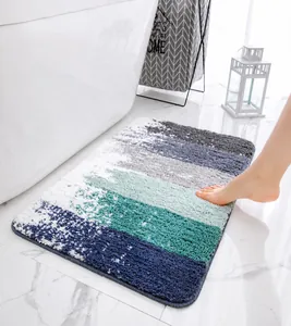 Detail of plush absorbent bath mat showing thick anti-slip texture and striped pattern