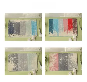 Detail of four colorful abstract gradient non-slip bathroom mats with high-density plush