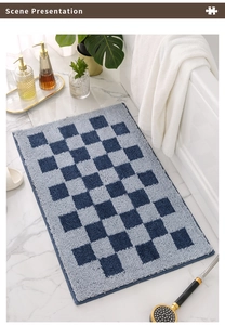 Détail du tapis de bain à carreaux avec texture touffetée épaisse et absorbante au sol