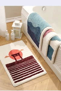 Close-up of high-density flocked bath mat with non-slip backing and mountain pattern