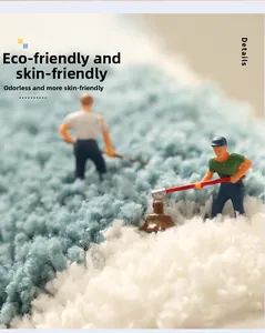 Close-up of thick blue and white plush bath mat fibers with creative miniature figures