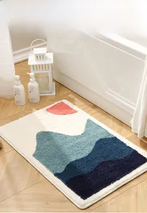 Macro detail of high-density flocked bath mat featuring colorful abstract mountain patterns