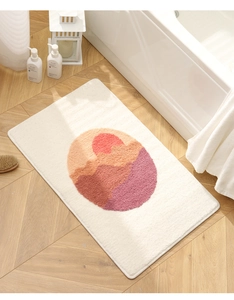 Detailed view of high-density flocked bath mat with abstract sunset mountain pattern