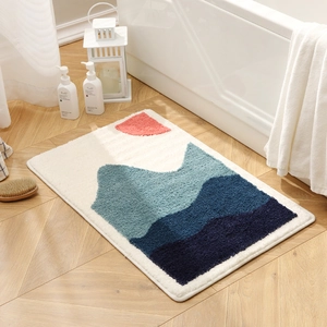 Absorbent bathroom mat with abstract mountain design on high density flocked non-slip fabric