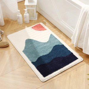 Absorbent bathroom rug with abstract landscape mountains and sun on a wood floor