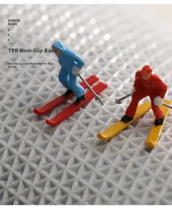 Macro shot of grey TPR non-slip backing with geometric diamond texture and ski figurines