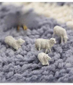 Macro shot of thick microfiber rug fibers with decorative white sheep figurines