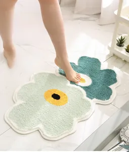 Detail of floral plush bathroom mat showing soft texture and high water absorption fiber