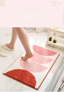 Close-up of thick plush absorbent bathroom mat with geometric semi-circle pattern