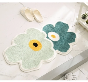 Detailed texture of daisy floral bathroom mat with thick absorbent flocking material