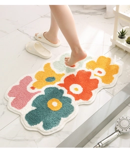 Macro detail of plush floral bathroom mat with thick absorbent microfiber texture