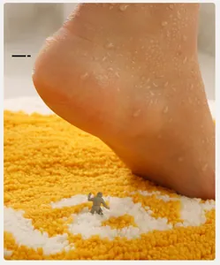 Detailed macro view of soft thick flocked absorbent bath mat showing long fibers