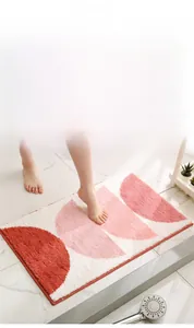 Detail of soft thick flocking bathroom mat with geometric semi-circle pattern