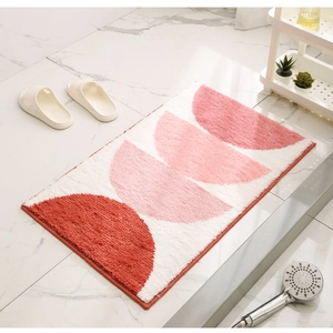 Detail of soft cream-style bathroom rug with geometric semicircles and plush texture