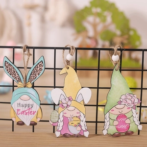 Detailed view of wooden Easter gnome ornaments with bunny ears and Happy Easter text