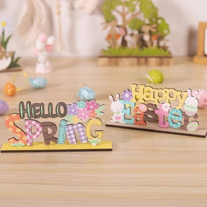 Macro detail of wood Easter ornaments featuring Hello Spring and Happy Easter print