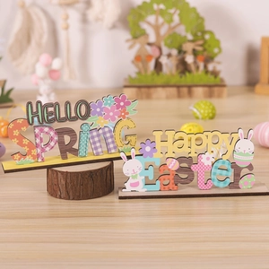 Detail of Happy Easter and Hello Spring wooden tabletop decorations with bunny and egg motifs