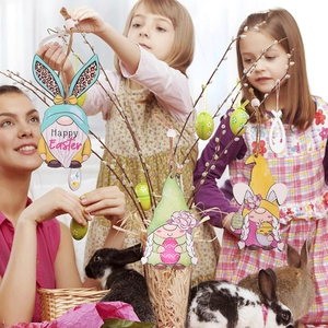 Easter Gnomes hanging ornaments with bunny ears and floral patterns on a festive willow branch