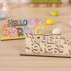 Wooden Easter table decorations featuring Hello Spring and Happy Easter bunny cutouts