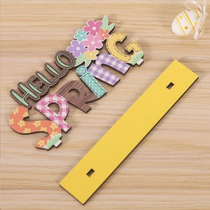 Close-up of Hello Spring wooden Easter table sign with colorful lettering and base