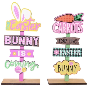 Easter wooden bunny and carrot table decorations featuring festive painted letter signage