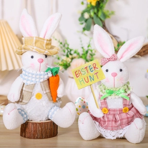 Detail of plush Easter bunnies featuring a felt carrot and an Easter Hunt sign decor