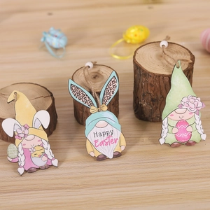 Three wooden Easter gnome pendants with bunny ears and 'Happy Easter' text on wood
